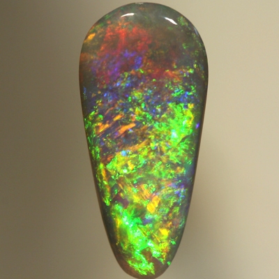 SOLID SEMI BLACK OPAL Pretty glittery show of greens and golds over blue and red. SEE VIDEO